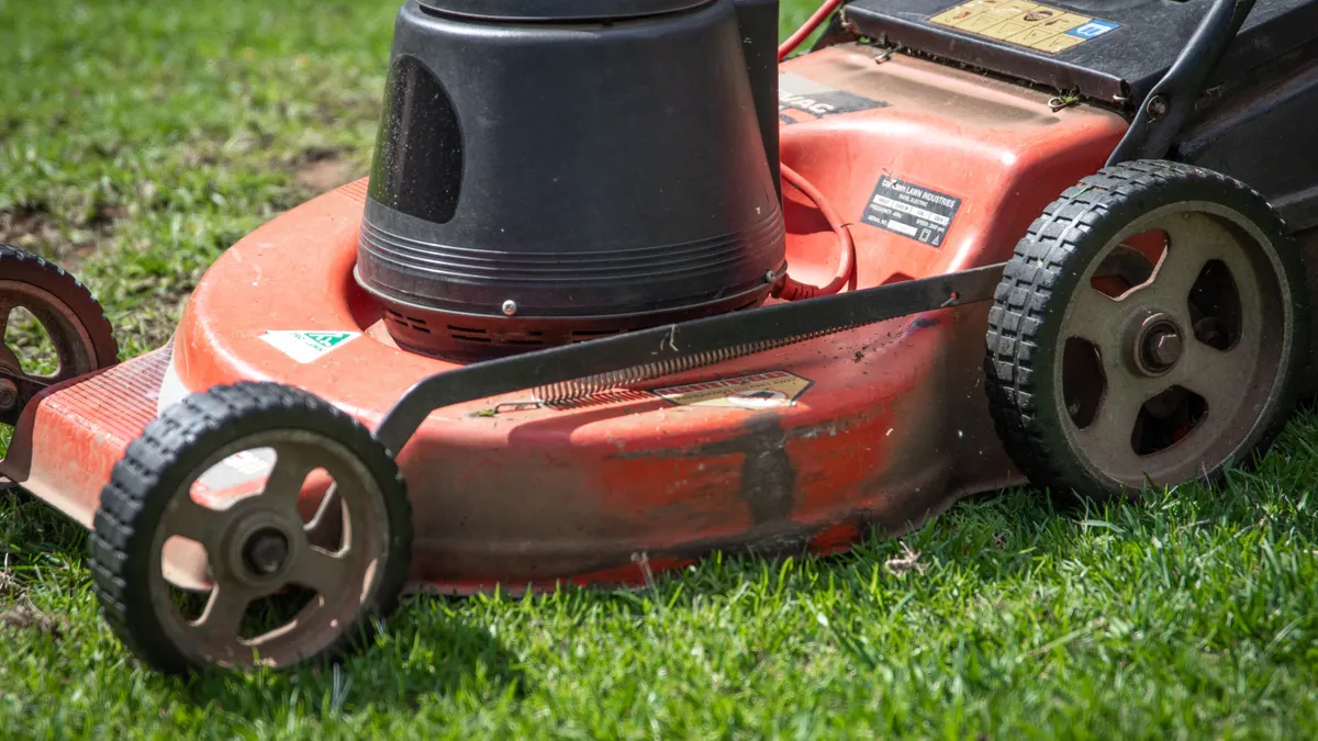 Sod Care Tools and Supplies — The Complete Guide red push lawn mower on turf